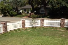 Front yard vinyl fence with brick columns